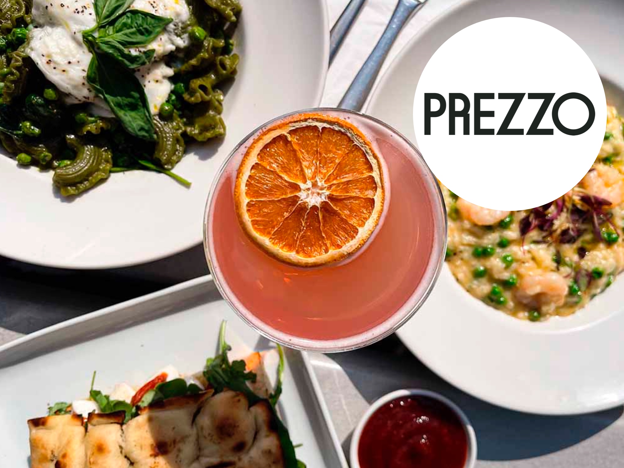 Pasta dishes with a fruity, orange cocktail on the side