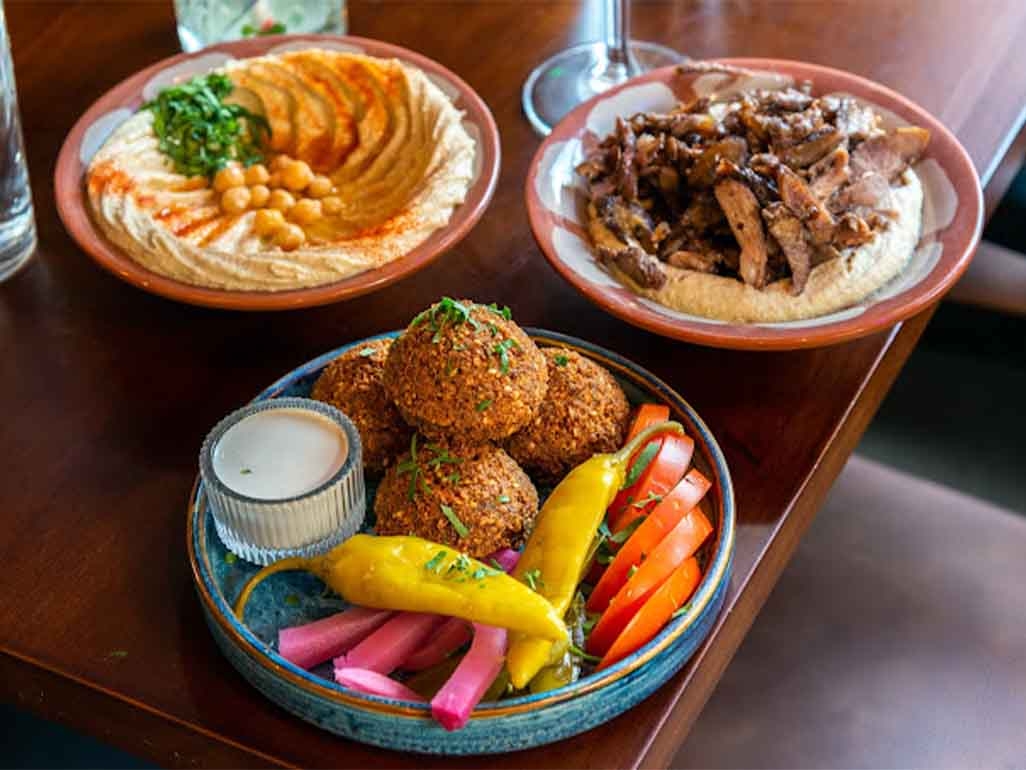 Chickpea hummus, roasted beef and falafel salad bowl