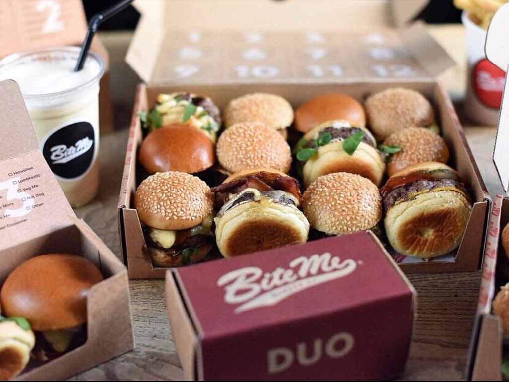 Bite me burger box of beef burgers with cheese, onions and salad