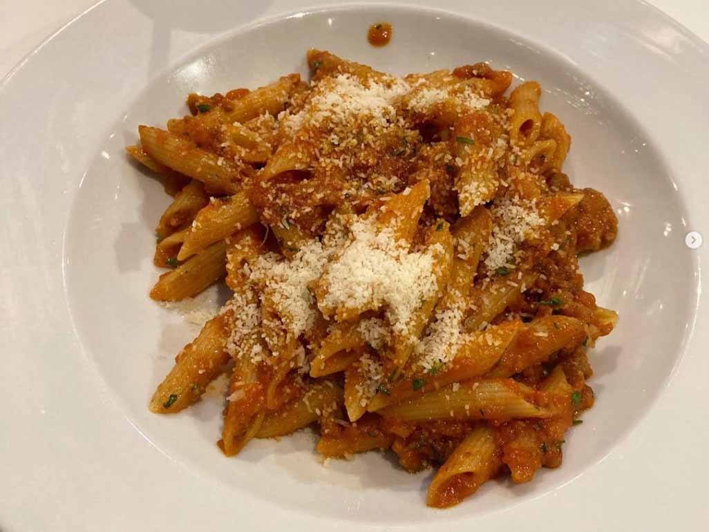 Pasta served with a ragu and parmesan 