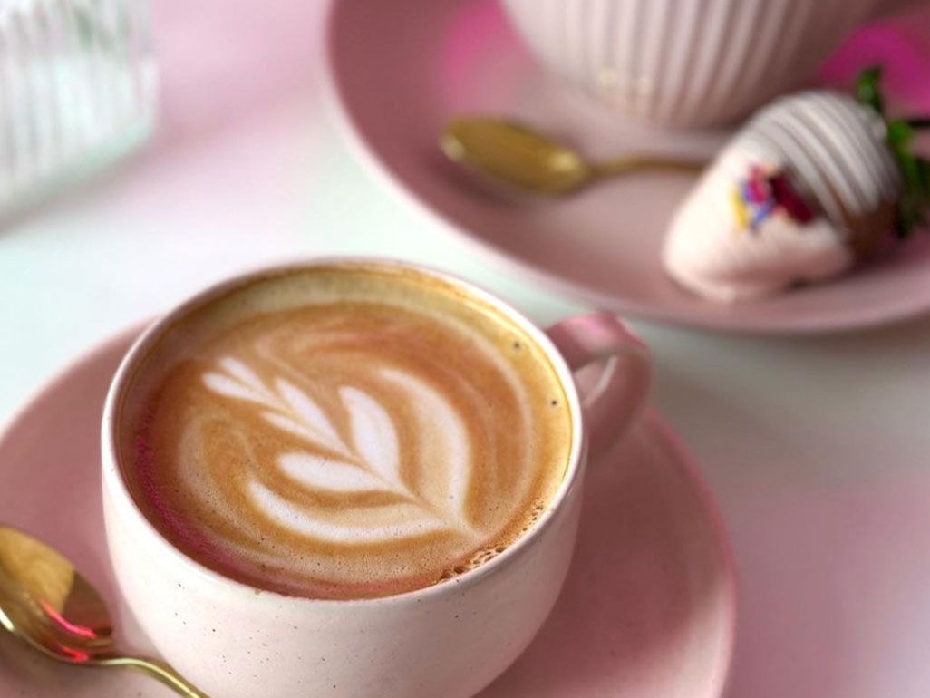 Coffee art in pink cup and saucer 