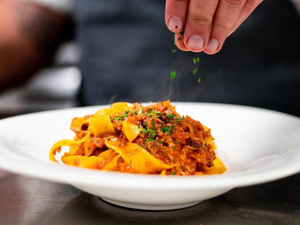Spaghetti bolognese with spaghetti and basil